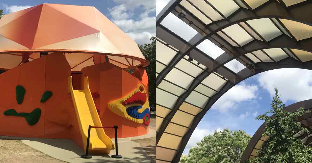 Play Pavillion and main Pavillion Large orange structure with Lego motifs and slide plus autumnal Perspex panels, trees and sky.