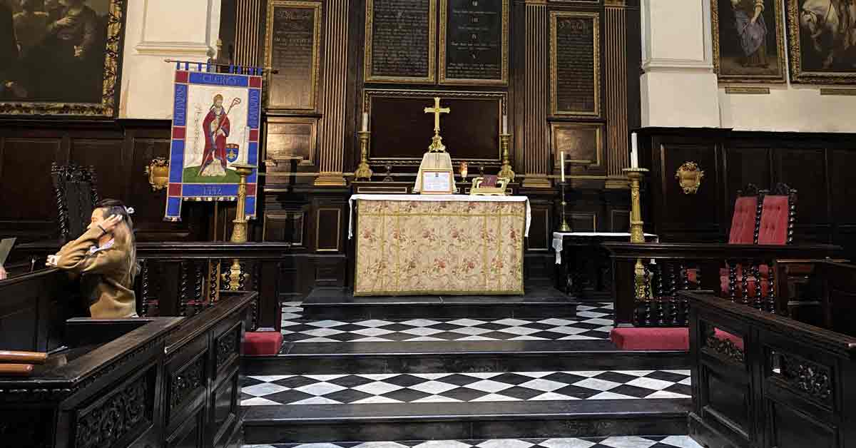 Alter with cross and black and white tiled floor.