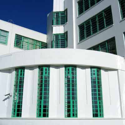 The white-painted art deco style exterior.