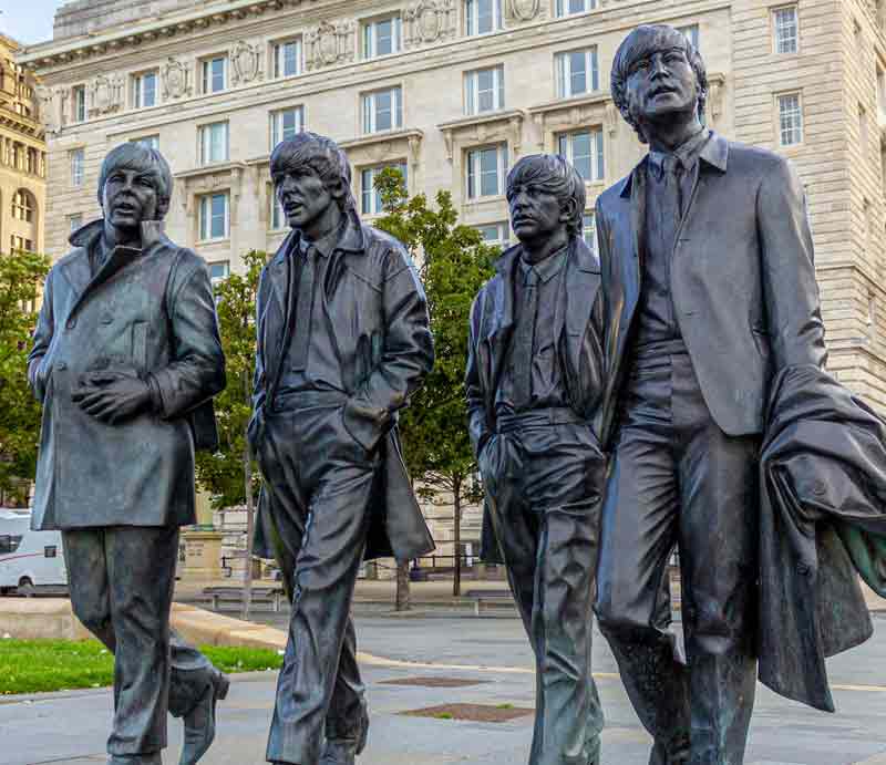 Walking along the street at Pier Head in Liverpool.