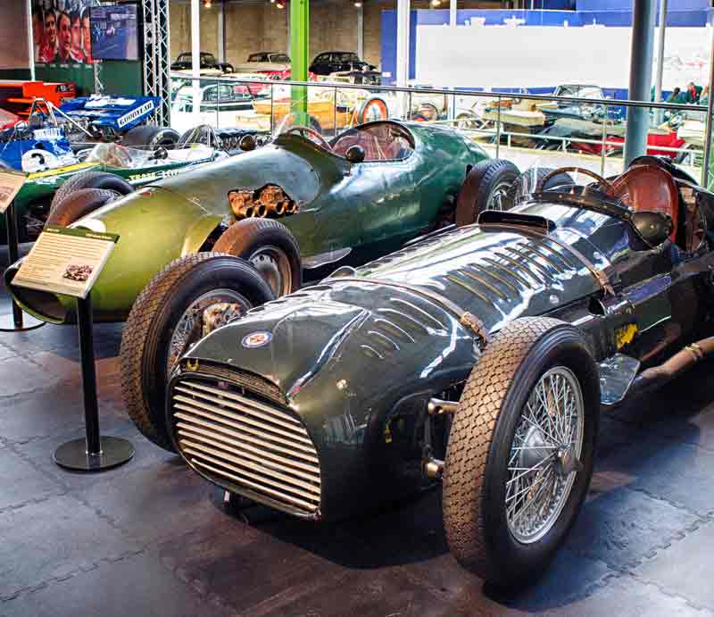 Classic racing cars A green 1950s Formula One BRM and other fifties cars.