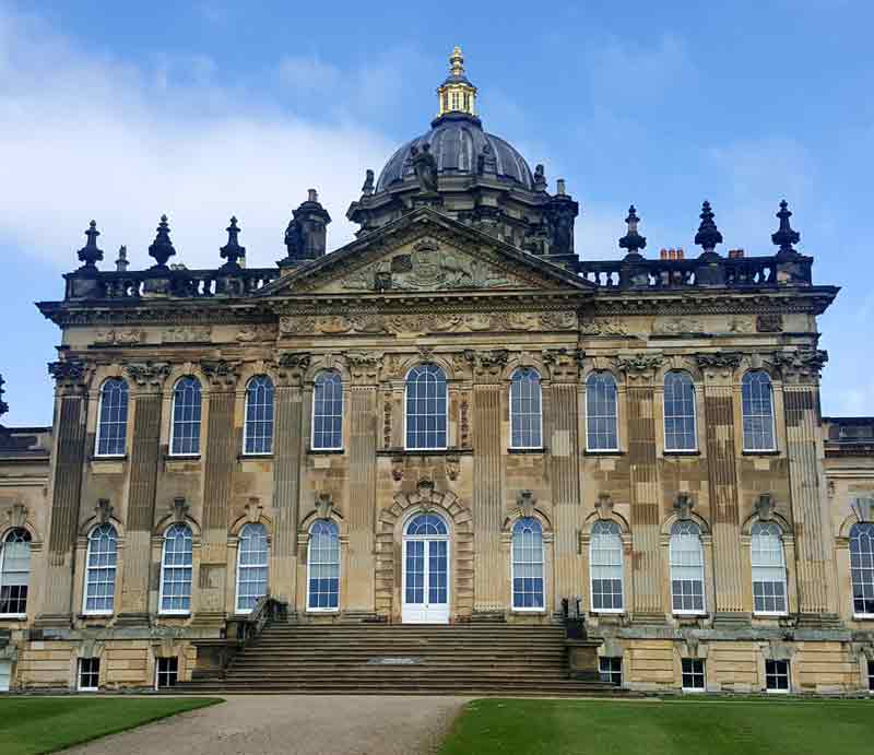 Palladian architecture of the facade with steps, two floors and ornate dome.