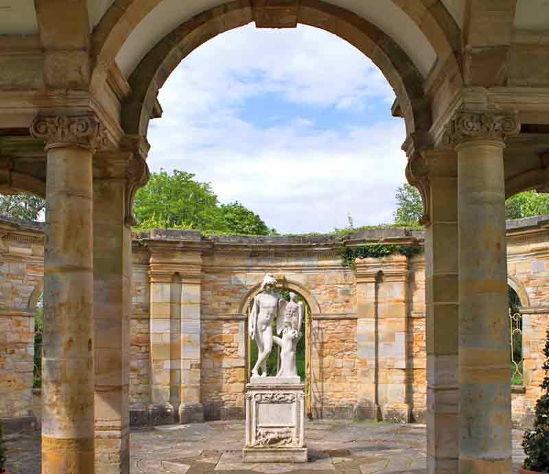 Ornate pillars, arch and statue.