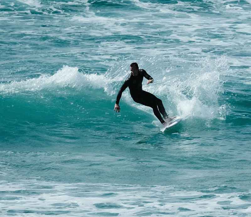 Surfer riding a wave.