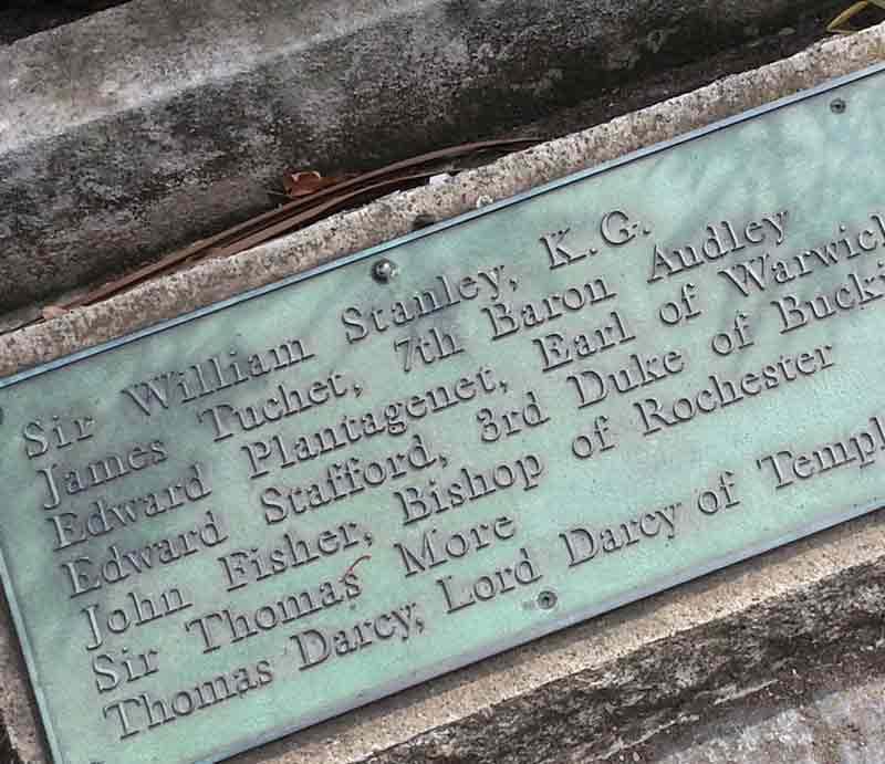 Green patina plaque displaying names of dignitaries.