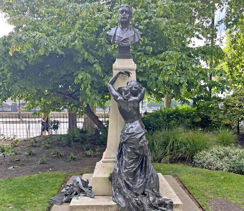 Bronze figure of a woman weeping.