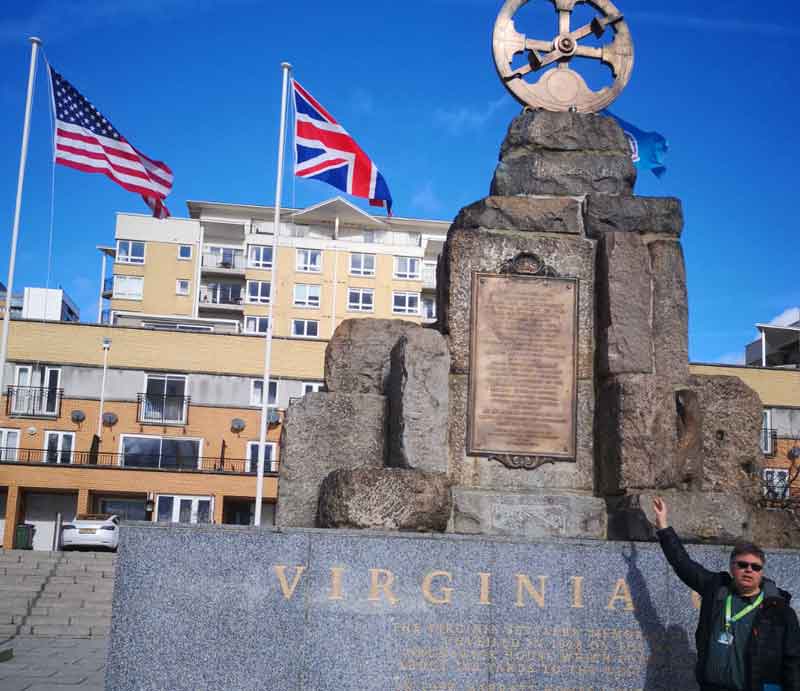 Rough-hewn granite base topped with a bronze mariner's astrolabe.