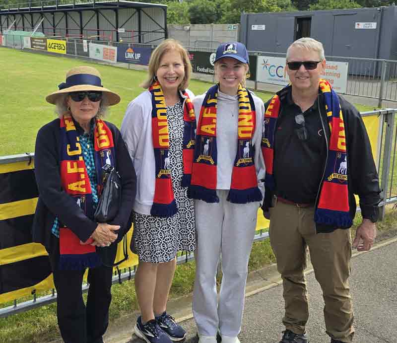 Pitchside wearing Richmond FC scarves.