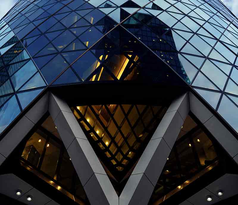 Triangular glass exterior and lower structure.