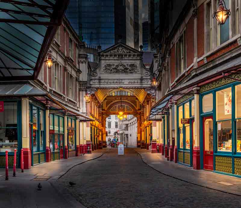 A walkway with ornate Victorian shops either side.