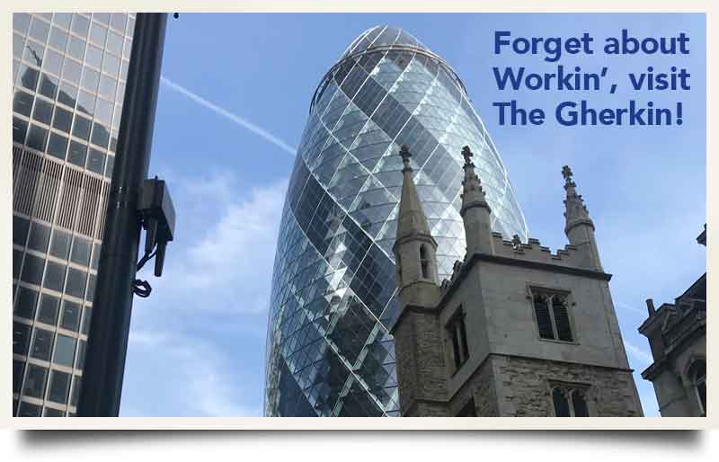 Behind a church with caption 'Forget about Workin', Visit The Gherkin.'.