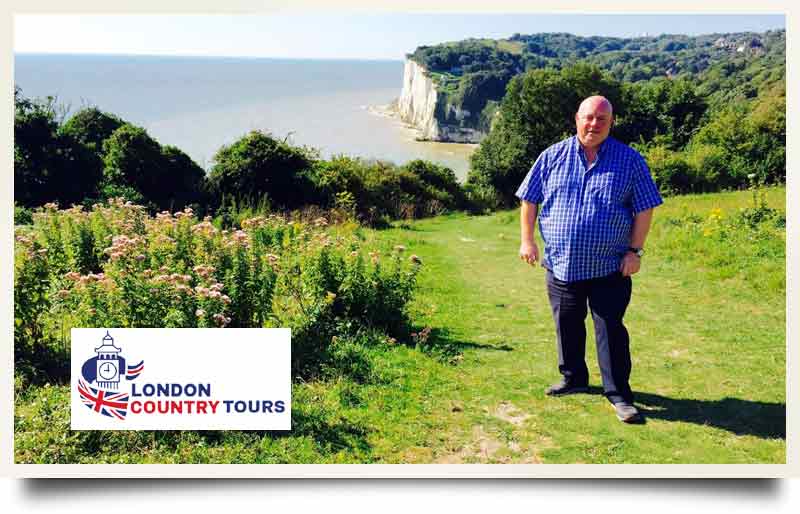 Dave Stubbs tour guide atop a West Country coastal cliff.