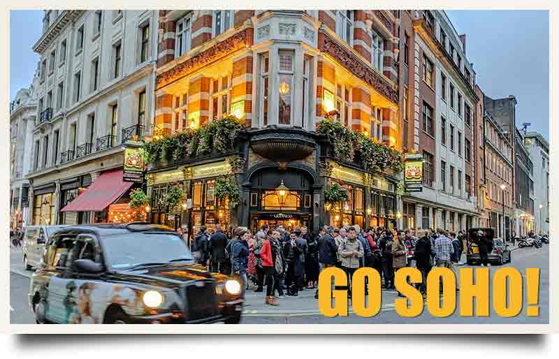 Customers outside a pub with black taxi cab and caption 'Go Soho!'