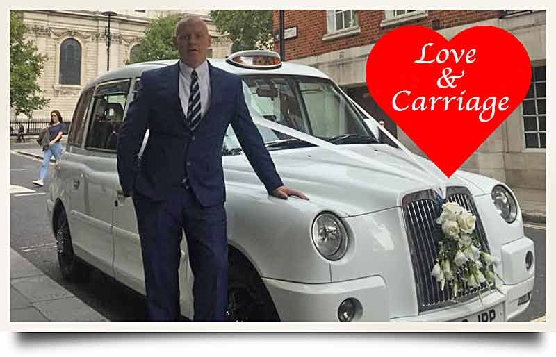 Driver John Parsons standing by his decorated taxi with caprion in red heart 'Love & carriage'.