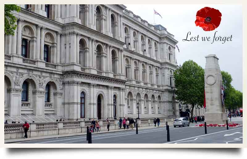 The Cenotaph with illustration of poppy and caption 'Lest we forget'.